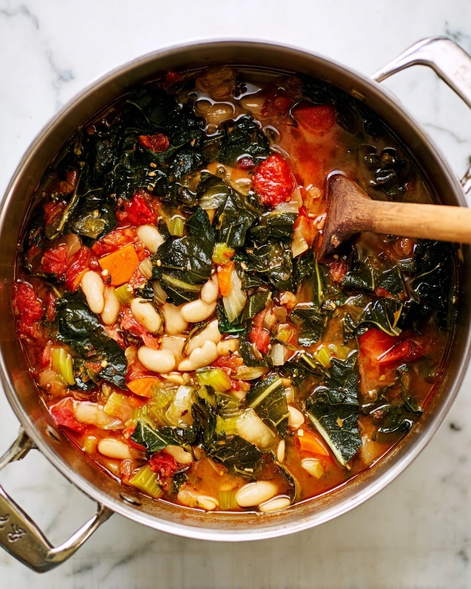 A shiny silver pot is filled with a colorful vegetable stew. The bottom and middle layers show a mix of bright red tomato pieces, orange carrot bits, and light green celery pieces in a thin broth. On top of this are large dark green leafy pieces, and scattered among them are many white beans. A wooden spoon with a long brown handle rests inside the pot, partly submerged in the stew. The pot sits on a white marbled surface photo taken with an iphone --ar 4:5 --v 7