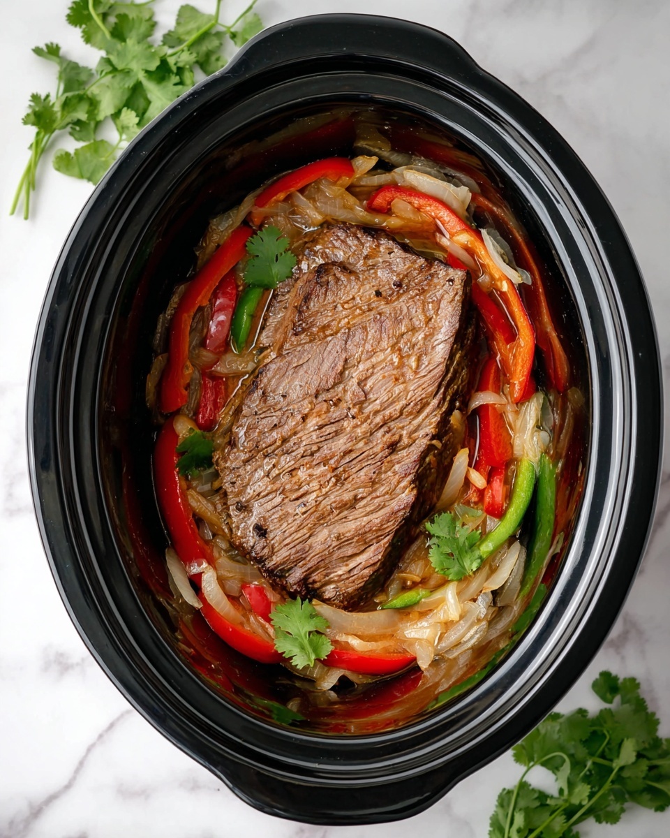 Inside a black slow cooker, a large piece of cooked meat lies flat in the center, brown and juicy with visible grill marks. Around the meat, there is a layer of sautéed sliced onions that are pale and soft, mixed with red and green bell pepper strips that add bright colors and a slightly glossy texture. The slow cooker rests on a white marbled surface, with fresh green cilantro leaves placed near the top left and bottom right corners for decoration. photo taken with an iphone --ar 4:5 --v 7