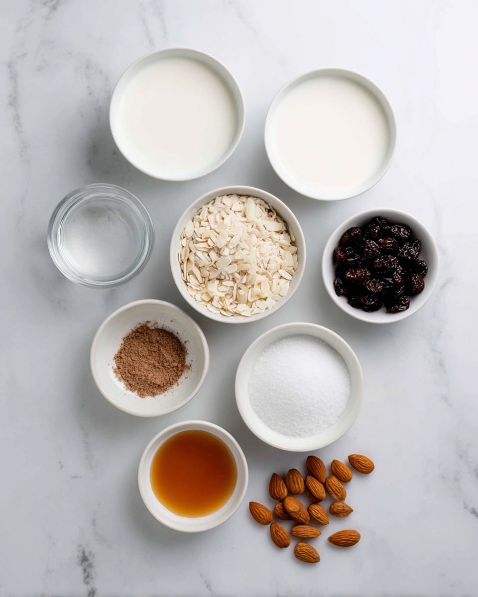 The image shows nine small white bowls and three almonds on a white marbled surface. On the top row, there are three bowls filled with clear water, thick white cream, and milk from left to right. Below them, two bowls hold light-colored rice in the middle and dark raisins to the right. The next row includes a bowl of slivered almonds on the left and a bowl full of granulated white sugar on the right. Further down, there is a smaller bowl filled with brown ground spice on the left, a bowl of fine white salt in the middle, and a bowl of amber-colored liquid on the bottom left. Three whole almonds are placed on the right side near the bottom. photo taken with an iphone --ar 4:5 --v 7