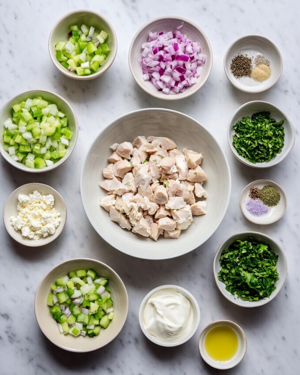 The image shows twelve small white bowls with different chopped ingredients placed neatly on a white marbled surface. In the center, there is a bigger white bowl filled with evenly chopped pieces of light-colored chicken. Surrounding it are small bowls containing finely chopped cucumber, celery, and green herbs, as well as diced red onion, a small bowl of creamy white yogurt, and a few other small bowls filled with what appears to be garlic, black pepper, feta cheese, olive oil, and salt. The bowls are arranged in a clear and tidy manner, showing a colorful mix of fresh ingredients. Photo taken with an iphone --ar 4:5 --v 7
