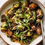 Creamy Sriracha Brussels Sprouts with Scallions and Sesame Seeds Recipe