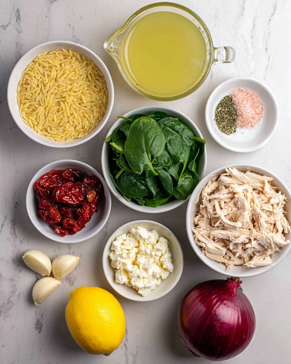 The image shows several small white bowls and loose items arranged on a white marbled surface. There is one bowl filled with light yellow orzo pasta grains at the top left, and another bowl at the bottom right with shredded cooked chicken in pale beige tones. A bowl of fresh dark green spinach leaves is in the middle, with a bowl of white crumbled cheese below it. To the left of the spinach is a bowl holding deep red sun-dried tomatoes. Near the center, three garlic cloves with light tan skin sit loose, along with a small white bowl containing pink salt and dried green herbs mixed. To the right, there is a whole deep red onion and a bright yellow lemon, both loose on the surface. Above, a glass measuring cup holds light yellow broth. photo taken with an iphone --ar 4:5 --v 7