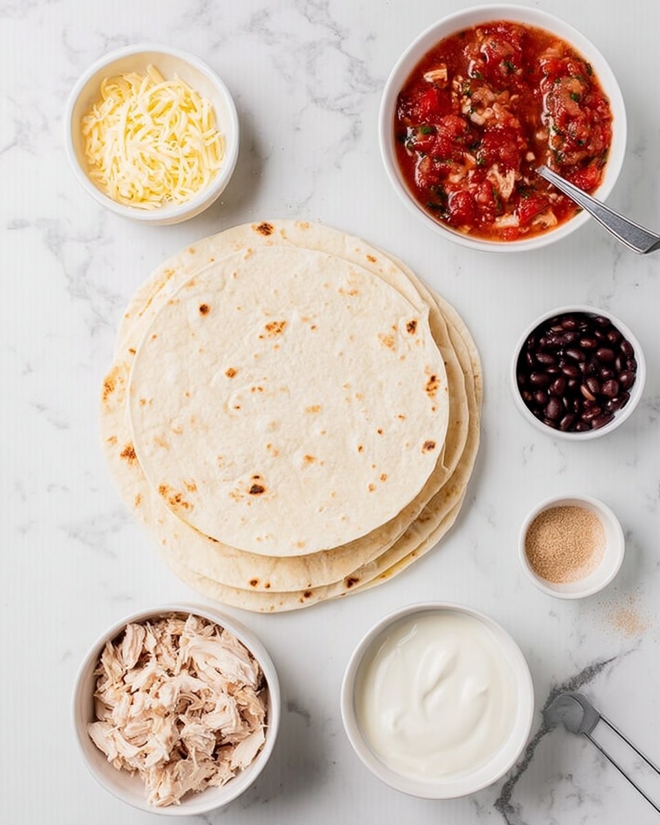 The image shows several layers of soft white tortillas stacked on top of each other on a white marbled surface. Around the tortillas, there are small white bowls filled with different ingredients: shredded pale yellow cheese, diced light brown cooked chicken, a red tomato-based salsa with chunks and herbs, smooth white sour cream or yogurt with a spoon inside, and small black beans in a white bowl. There is also a small white bowl with a light brown powder, likely a spice mix, and a measuring cup with more black beans. The arrangement is clean and bright with a light and fresh feel. Photo taken with an iphone --ar 4:5 --v 7