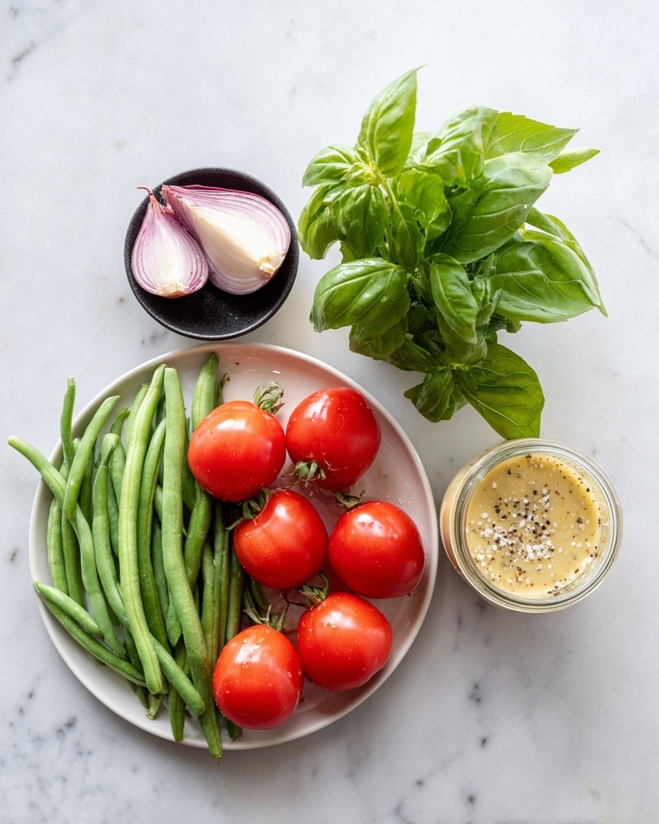 The image shows fresh ingredients on a white marbled surface. On a white plate, there are six bright red tomatoes still on the vine and a pile of long green beans next to them. Above the plate is a small black bowl with two halves of a light purple shallot and a bunch of fresh green basil leaves. To the right, there is a small jar filled with a creamy yellow dressing sprinkled with black pepper and small bits of shallot. Photo taken with an iphone --ar 4:5 --v 7