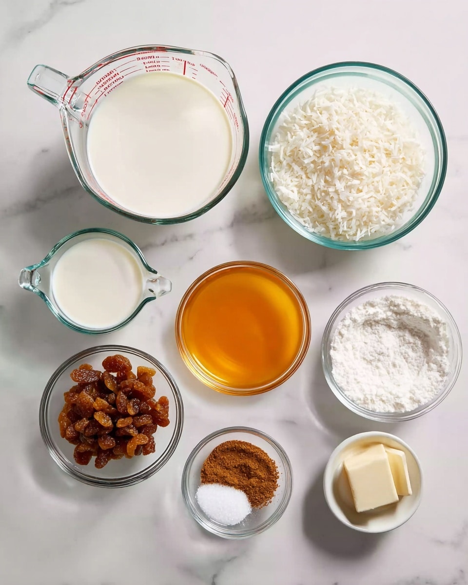 The image shows nine clear glass bowls and measuring cups arranged on a white marbled surface. The largest measuring cup at the top center holds a white liquid, likely milk. To its right is a medium bowl filled with white shredded coconut. Below the milk cup and to the left is a smaller measuring cup with a similar white liquid. Below that is a medium bowl with a bright orange liquid, probably melted butter. In the middle, a bowl contains light brown raisins. To the right of the raisins, a bigger bowl holds white granulated sugar. A small bowl with brown powder, probably cinnamon, is at the bottom center. To the right of it, a tiny bowl has white granules, possibly salt, and finally, on the far right, a very small bowl contains a light brown liquid, likely vanilla extract, and a tiny square piece of butter. photo taken with an iphone --ar 4:5 --v 7