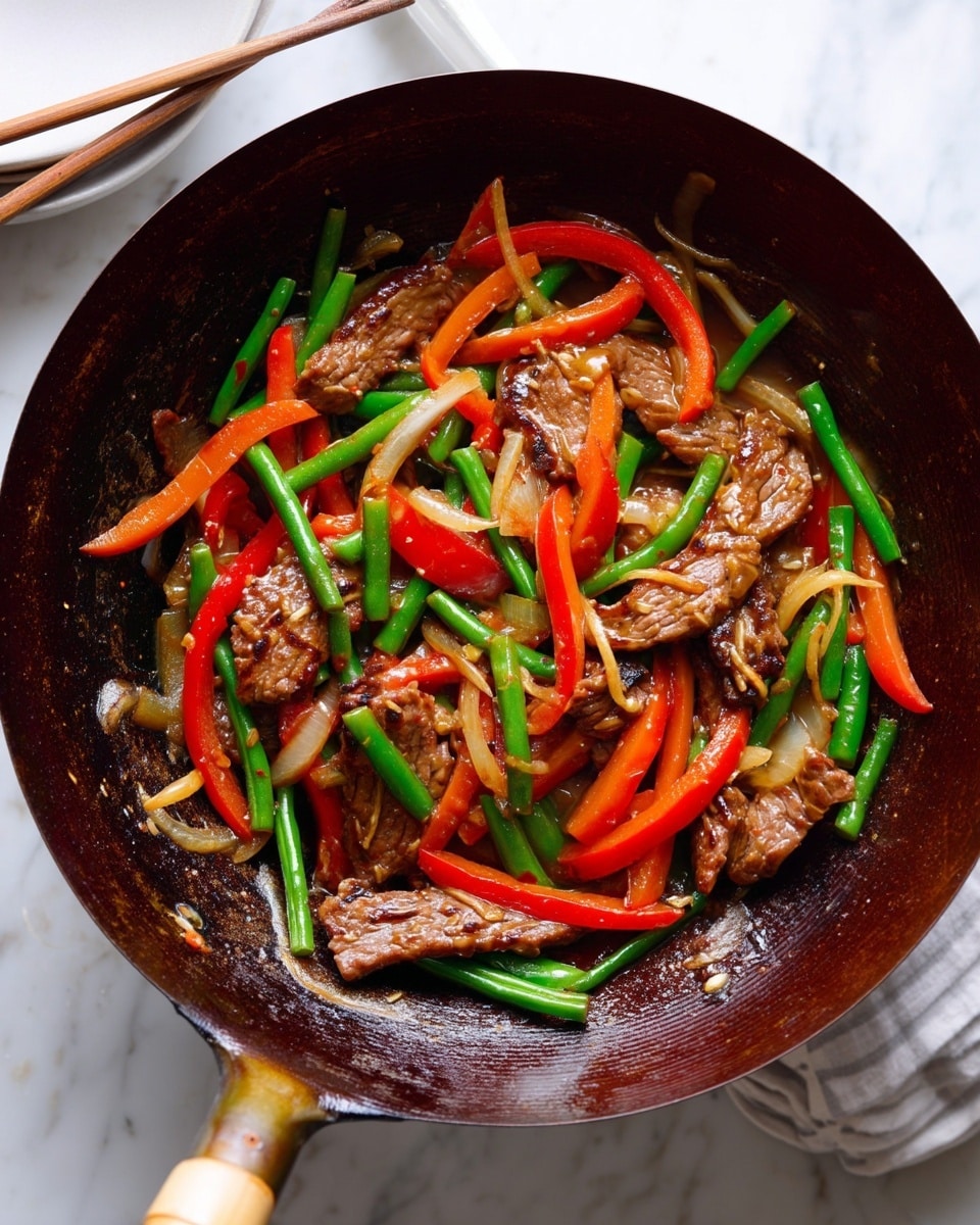 A dark wok filled with stir-fried slices of brown cooked meat mixed with thin strips of red bell pepper, long green beans, and light brown onion slices, all glossy with sauce. The handle of the wok is visible and shows some wear. The background is a white marbled surface with two white plates and wooden chopsticks in the upper left corner. photo taken with an iphone --ar 4:5 --v 7